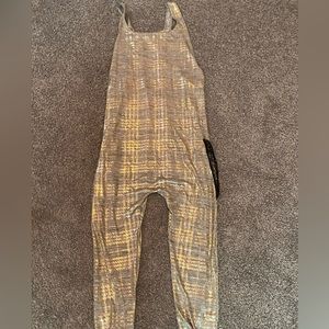 silver and gold jumpsuit w/ black sports bra top